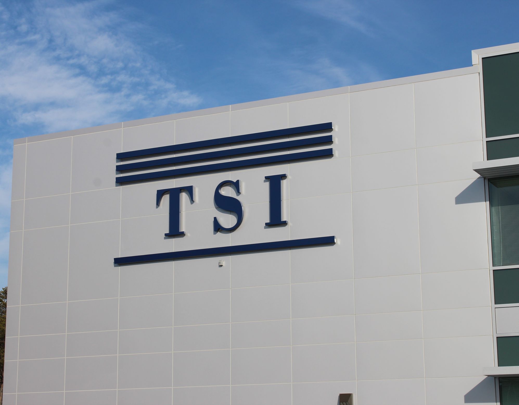 Historical photo of TSI Corporations early construction projects and team